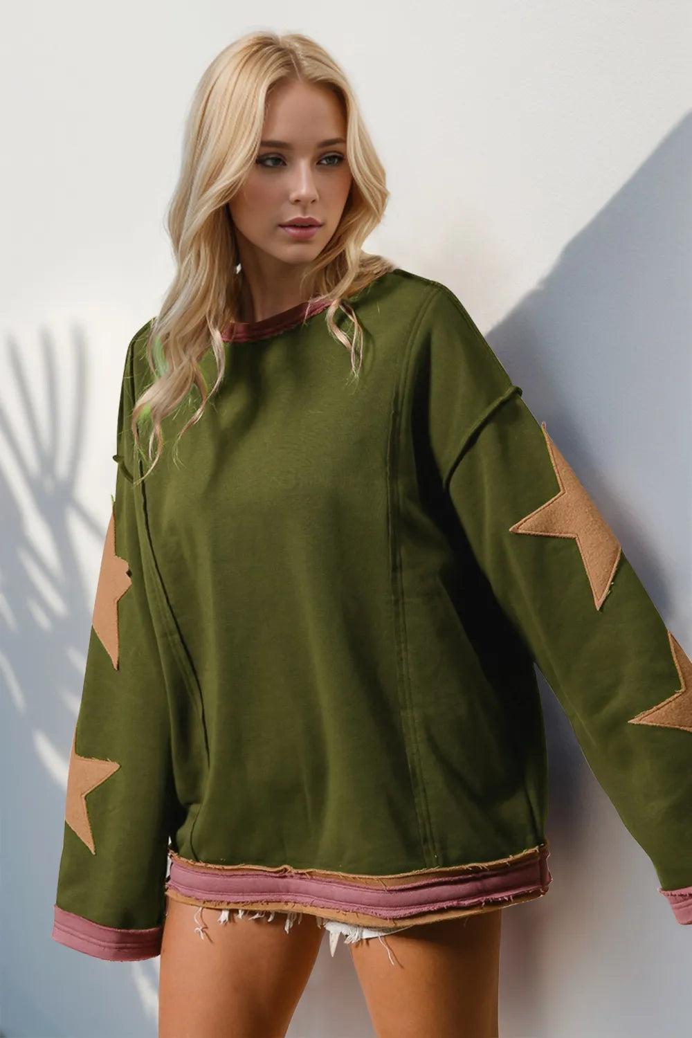 Double Take Star Patched Long Sleeve Sweatshirt.